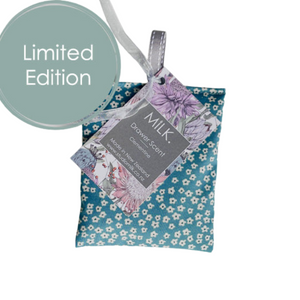 Floral-patterned product with a tag labeled 'Milk' on a white background