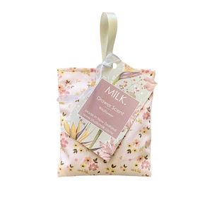 Floral-patterned drawer scent with 'MILK.' label on a white background