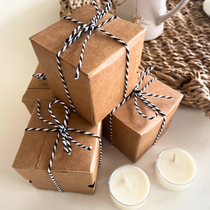 Tea lights on a table with Kraft box packaging 