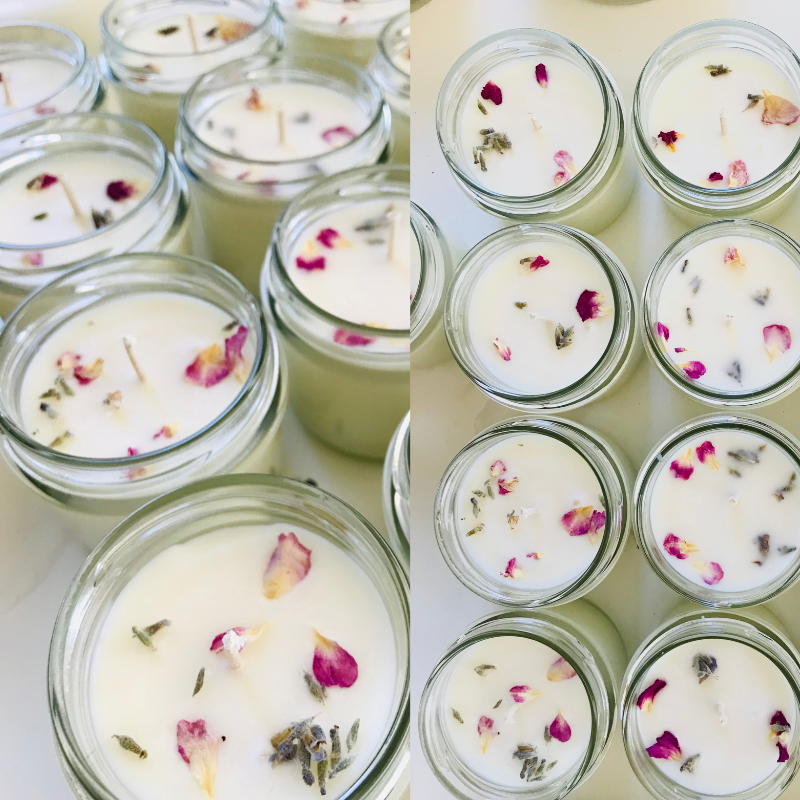 Candles in a glass jar with dried flowers 